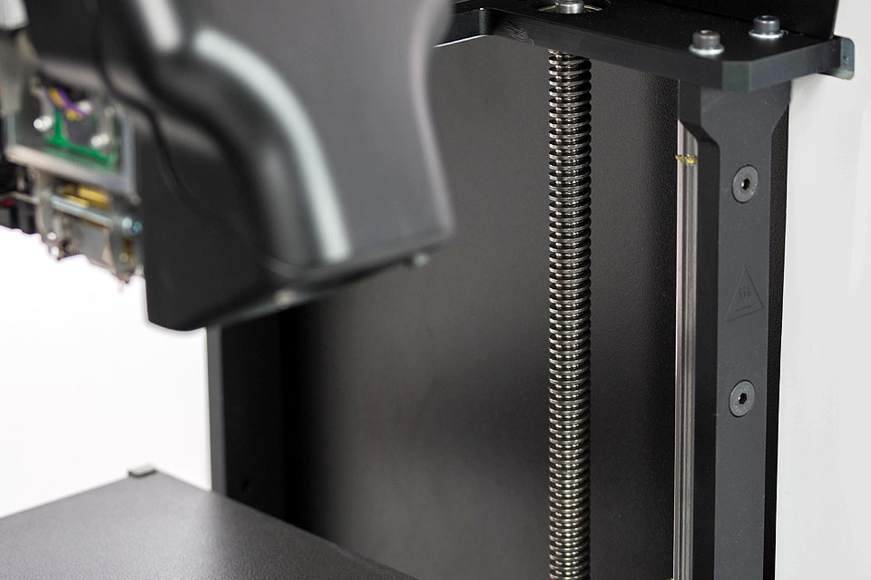 Professional 3D printer 3DGence DOUBLE P255. Close-up of leveling screws.